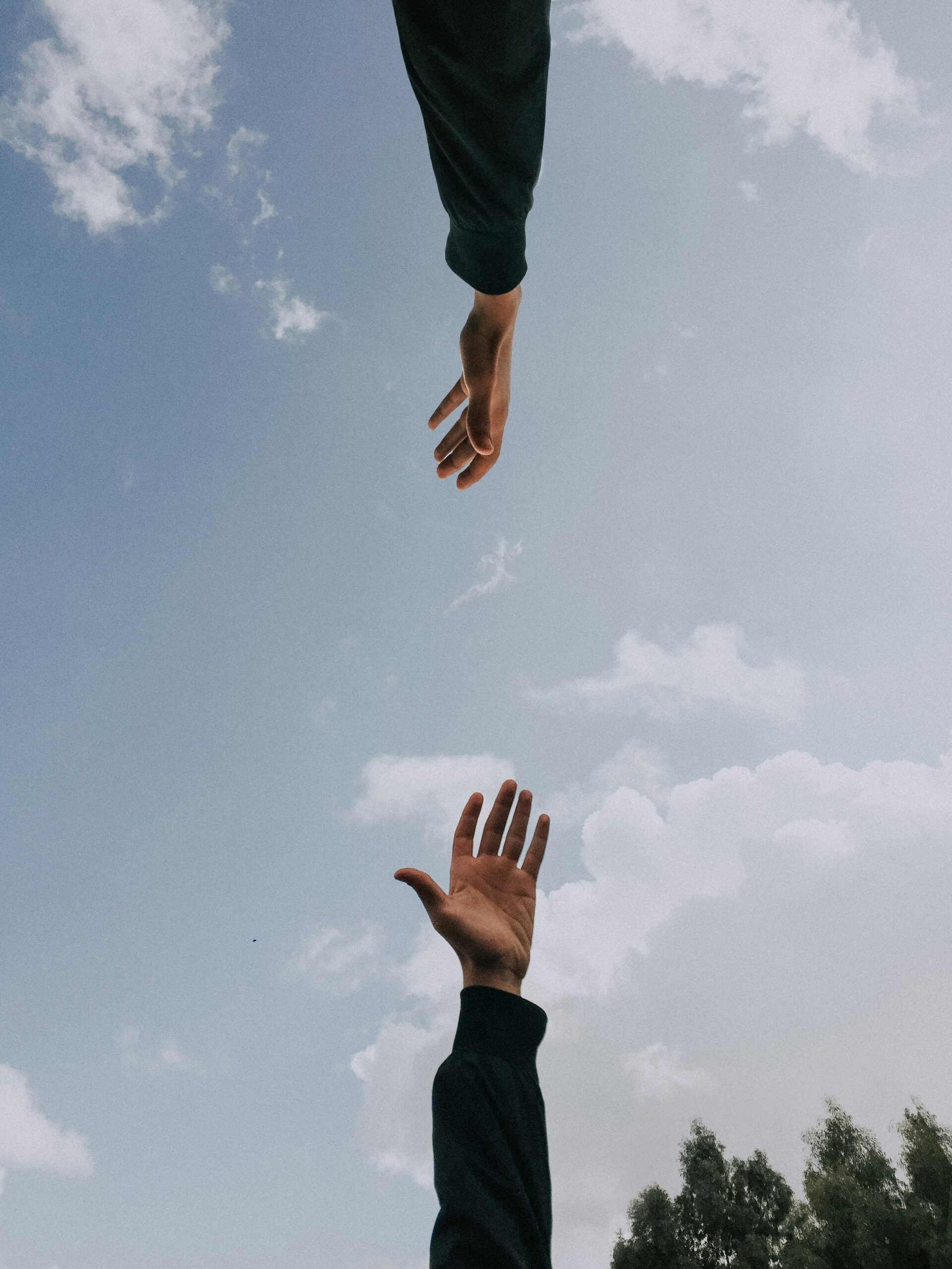 two hands reaching to each other